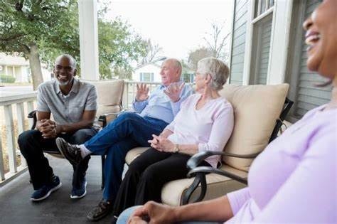 Neighbors enjoying the front porch at Old Towne Estates